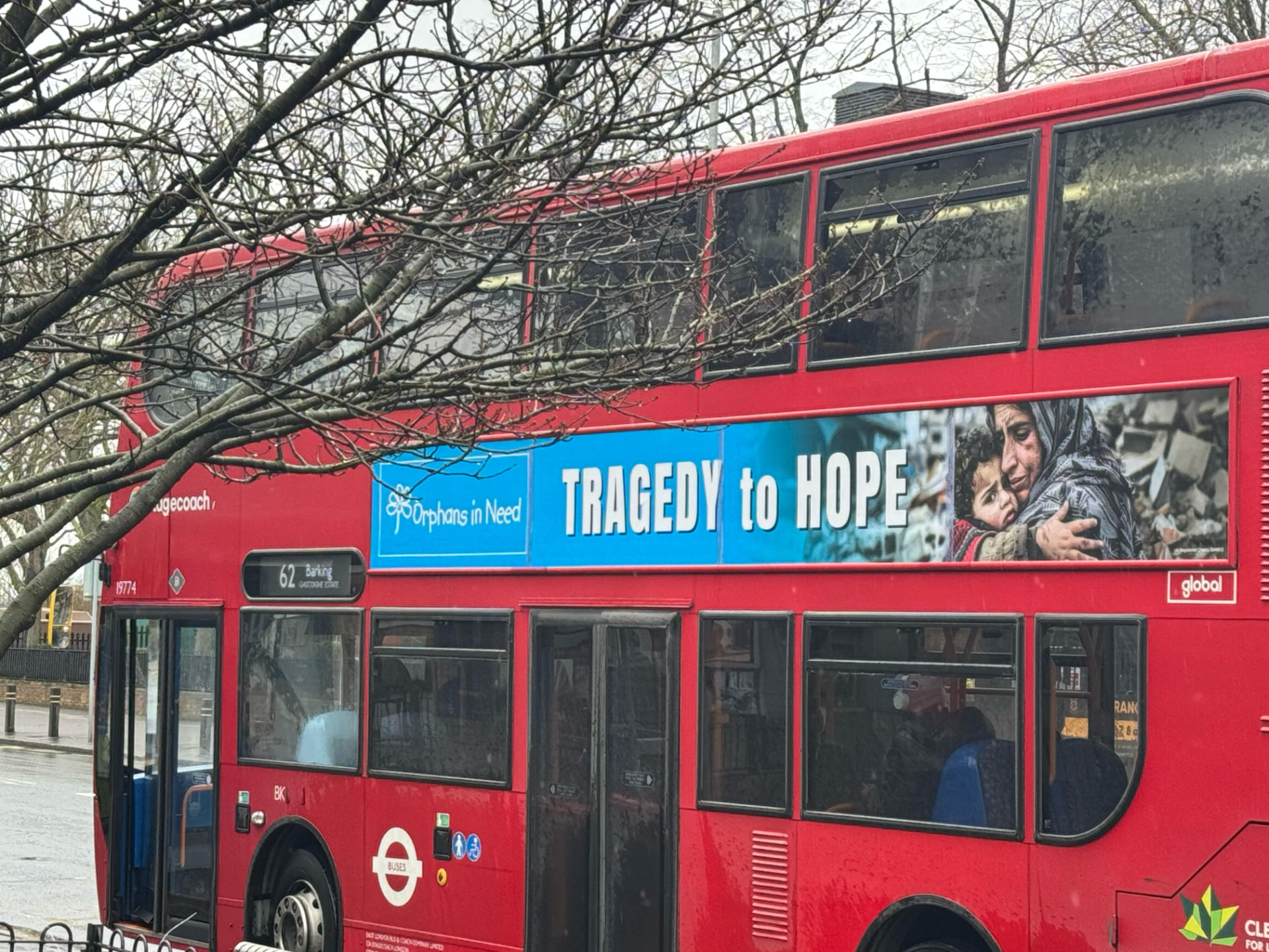 Orphans in Need 'Tragedy to Hope' bus superside on a London route