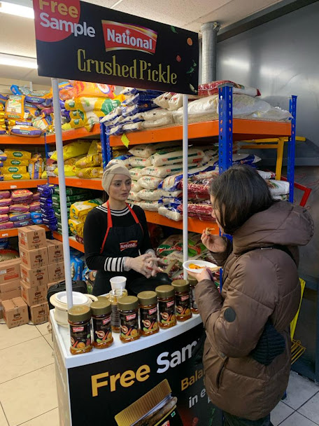 National Foods free sampling stand inside an ethnic grocery store
